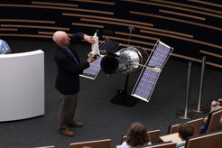 ESA astronaut Claude Nicollier explains one of his Hubble Space Telescope repair missions to elementary school students