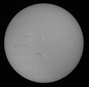 Black&white image of the transit of Mercury on 9 May 2016 as seen in H alpha. Mercury is visible as a small black dot near the upper rim of the Sun. Black&white image of the transit of Mercury on 9 May 2016 as seen in H alpha. Mercury is visible as a small black dot near the upper rim of the Sun.