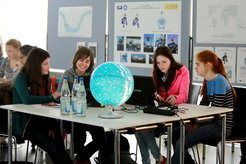 Participants of the 2015 Girls' Day at Haus der Astronomie processing astronomical images - some of which came from remote observations made by the girls themselves.