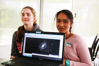Participants of the Girls' Day 2016 event at Haus der Astronomie display a galaxy photo they have taken via an internet-controlled telescope. Participants of the Girls' Day 2016 event at Haus der Astronomie display a galaxy photo they have taken via an internet-controlled telescope.