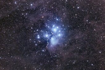 Long exposure close-up of the Pleiades, showing blueish nebulae around the brighter stars Long exposure close-up of the Pleiades, showing blueish nebulae around the brighter stars