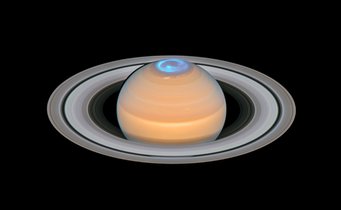 Close-up of the planet Saturn in visible light overlaid with a UV image showing auroras around the planet's north pole as a light blue ring Close-up of the planet Saturn in visible light overlaid with a UV image showing auroras around the planet's north pole as a light blue ring