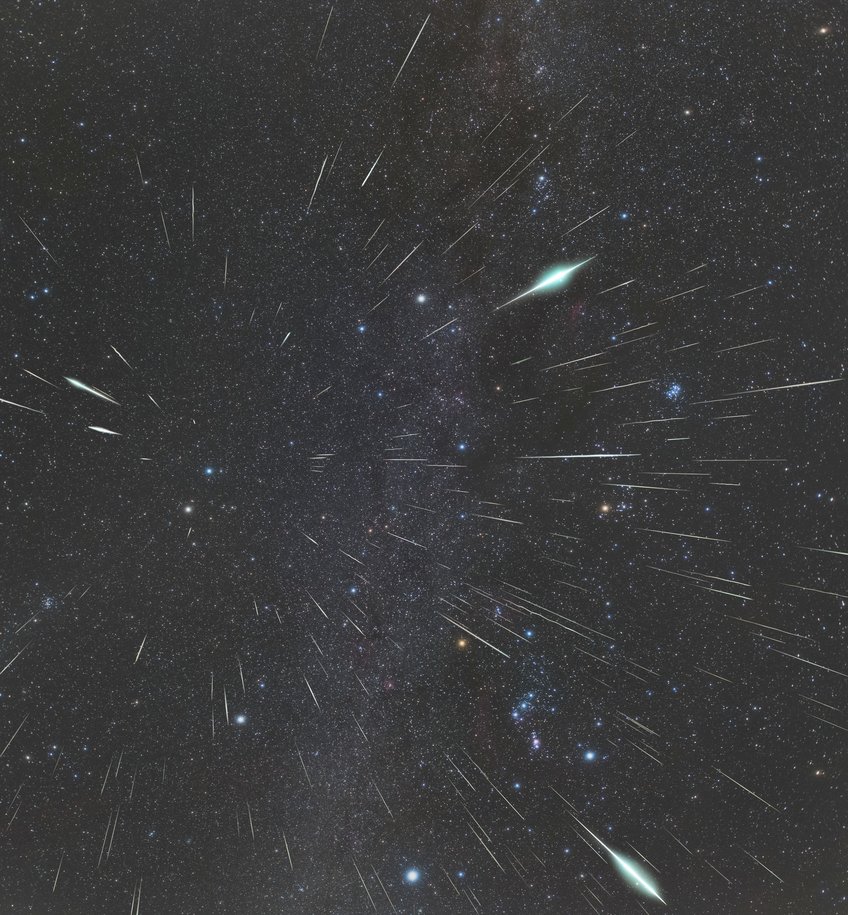 Geminid meteors seem to originate from a point above the two bright stars Castor and Pollux in Gemini. Many bright stripes in the night sky, some with a particularly bright bulge, appear to point in all directions from a point above two bright stars. The constellation Orion is at bottom right
